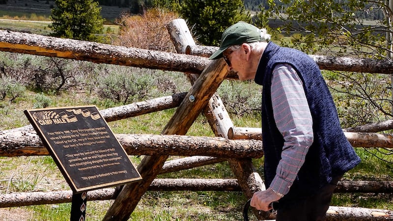Bruce Walker looks at the plaque commemorating Camp Hale and Tibetan resistance fighters in June 2024.