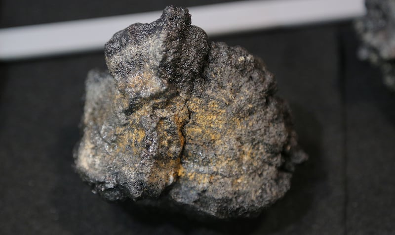 A polymetallic nodule from the seabed is displayed at a mining convention in Toronto, Canada, on March 4, 2019.