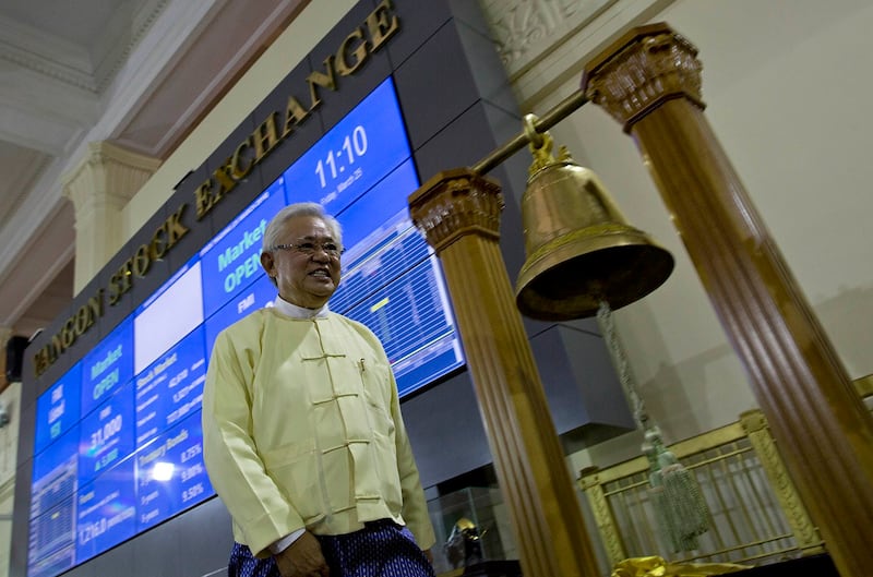 Yoma Bank CEO U Thein Wai, also known as Serge Pun, smiles as electronic trading commences during the opening day of trading at Yangon Stock Exchange, March 25, 2016. (Gemunu Amarasinghe/AP)