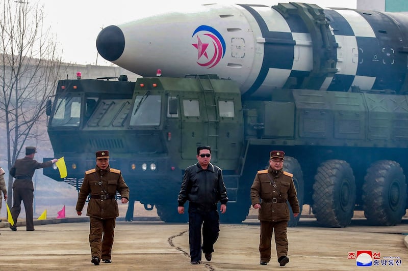 This image distributed by the North Korean government on March 24, 2022, and not independently verifiable shows leader Kim Jong Un walking away from what state media reports as a "new type" of intercontinental ballistic missile.
